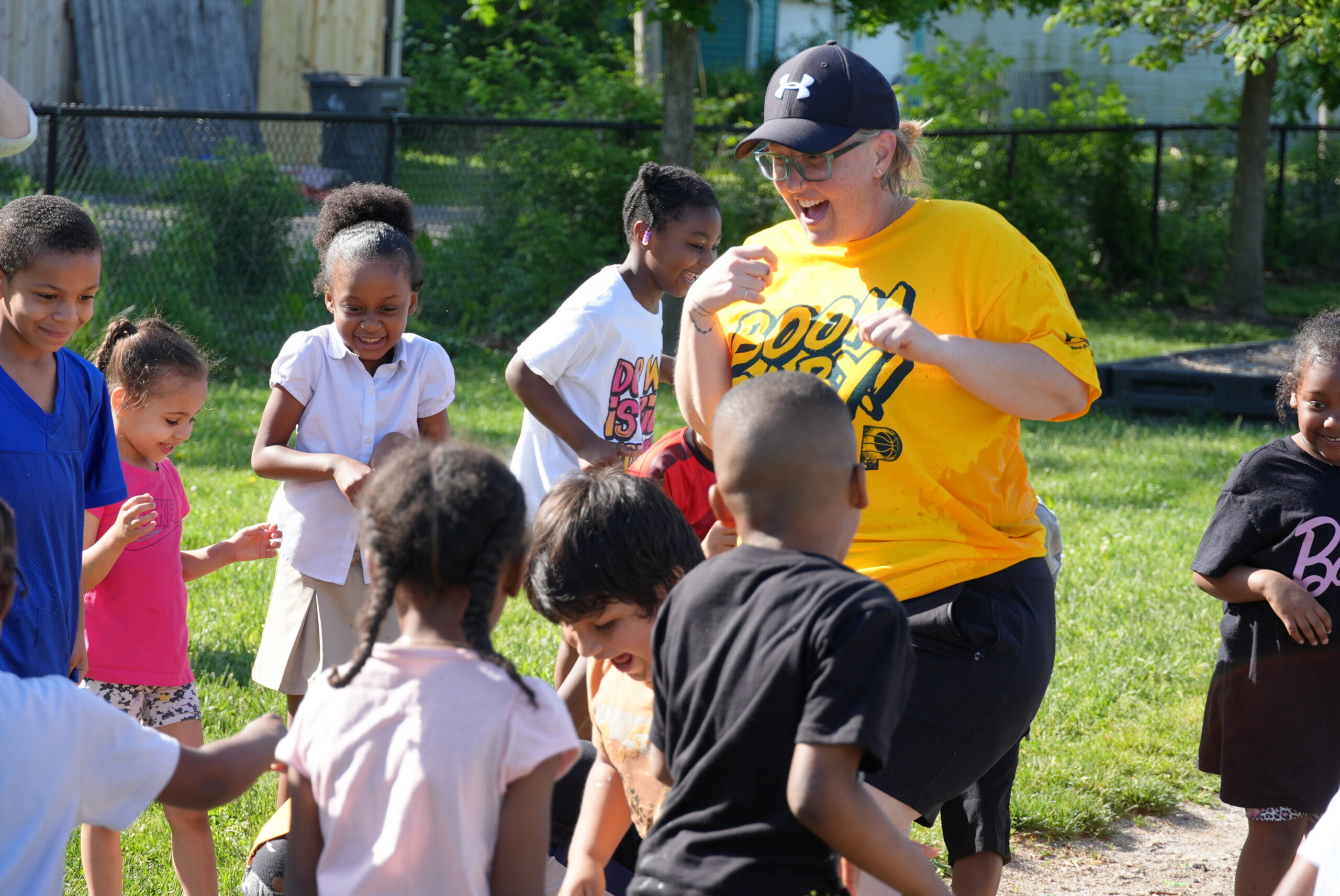 Paramount Brookside students and a staff member participate in outdoor Field Day activities.