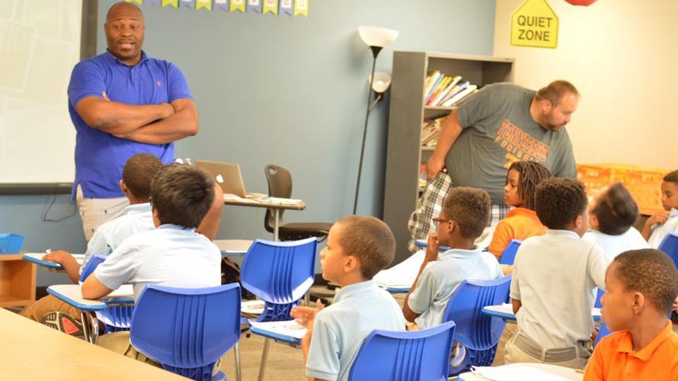 Educator speaks to Paramount students seated in a classroom.