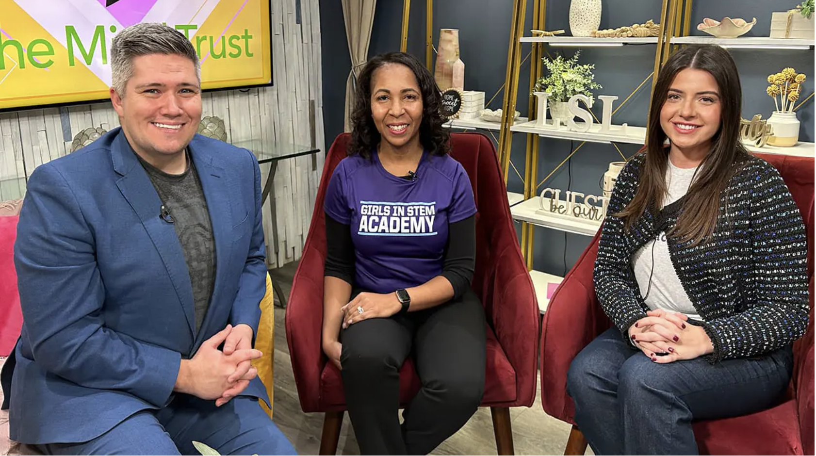 Girls IN STEM Academy representative joins two hosts for an in-studio television interview.