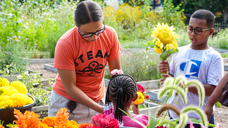 cotta-home-parent-center-3 Paramount Cottage Home students exploring flowers and sunflowers with