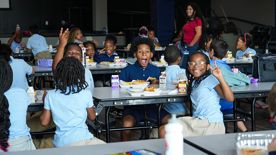 cottage-home-home-4-2 Paramount Cottage Home students smiling and enjoying lunch together in the school cafeteria