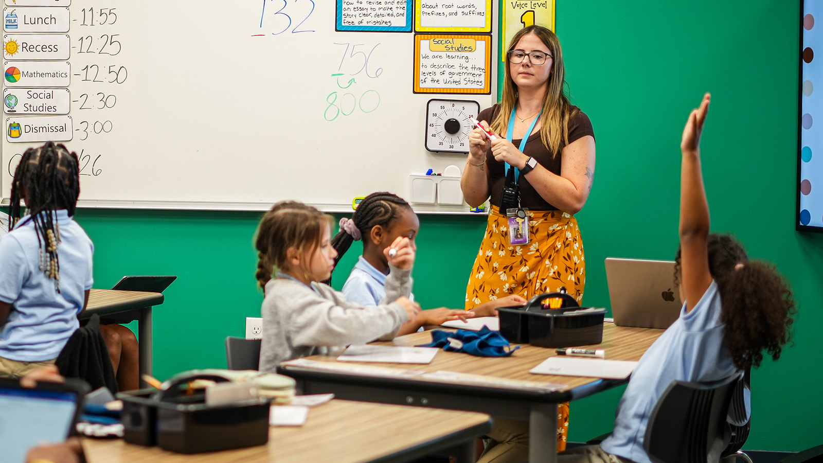gisa-staff-hero-updated Girls IN STEM Academy teacher leading an interactive classroom lesson as students participate and raise their hands