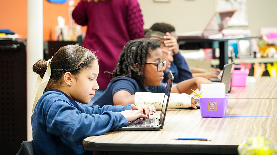 Paramount Lafayette students working independently on laptops during a classroom learning activity