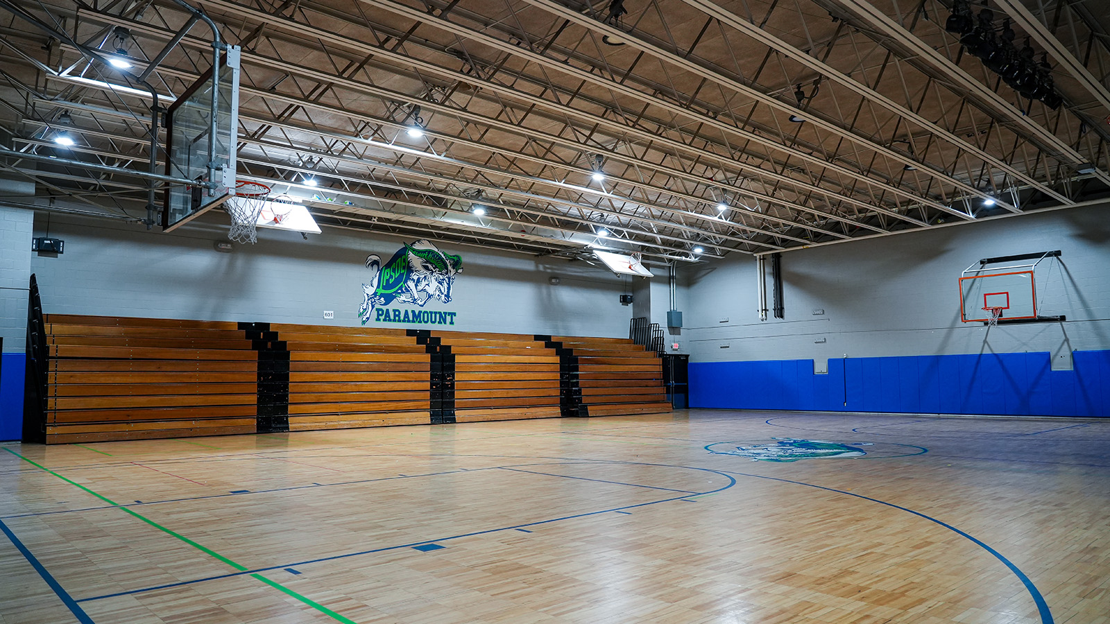 south-bend-visit-tour Paramount South Bend school gymnasium featuring basketball courts, wooden bleachers, and Paramount school branding